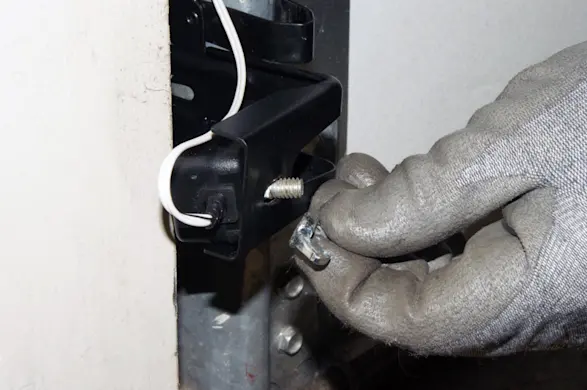 PHOTO: Install the new safety sensors.