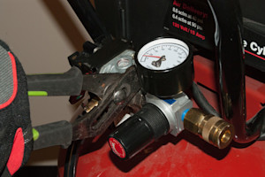 Unscrew the pressure regulator assembly.