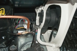 PHOTO: Reinstall the fan motor bracket screws.