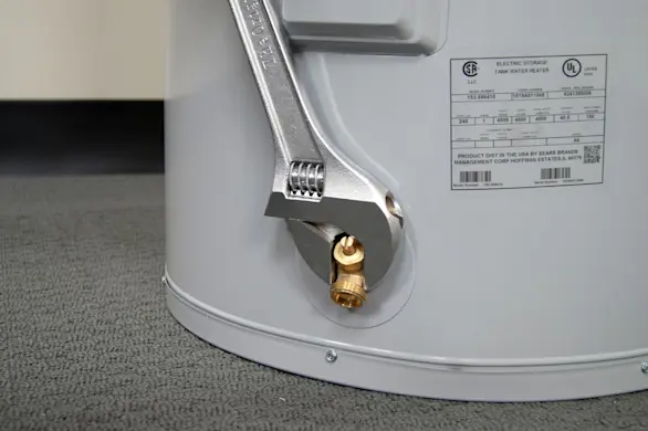 PHOTO: Remove the drain valve.