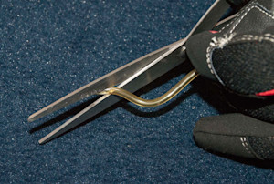 Cut one end of the large fuel line at an angle.