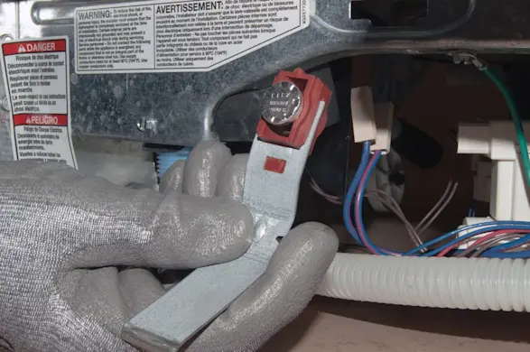 PHOTO: Remove the high-limit thermostat.