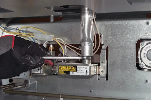 PHOTO: Tighten the bake burner orifice.
