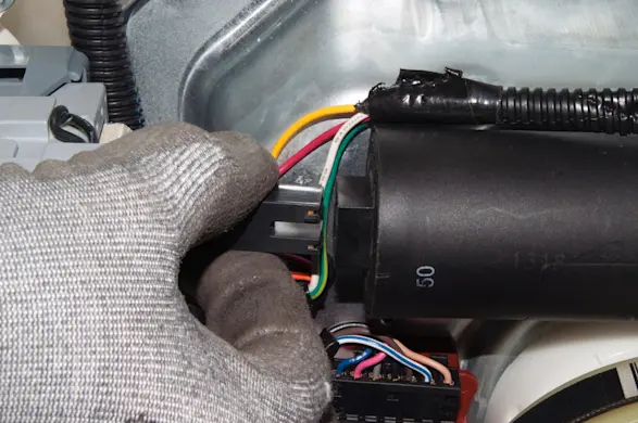 PHOTO: Reconnect the capacitor.