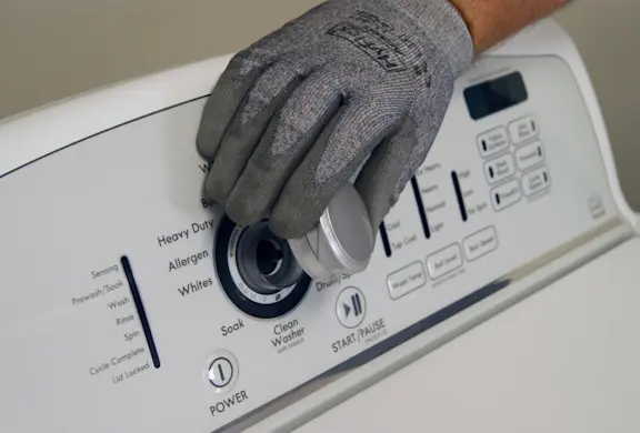 PHOTO: Remove the control knob from the control panel.