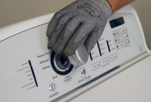 PHOTO: Remove the control knob from the control panel.