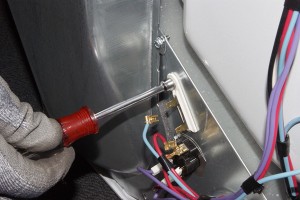 PHOTO: Remove the thermal fuse mounting screw.
