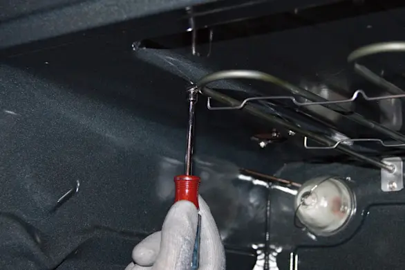 PHOTO: Remove the support bracket screws.