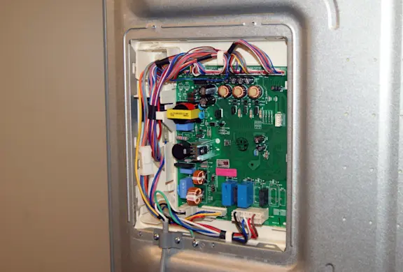 PHOTO: Remove the control board cover.