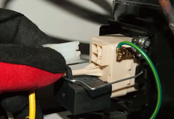 PHOTO: Disconnect the start relay wires.