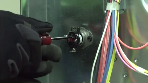 PHOTO: Remove the mounting screws.