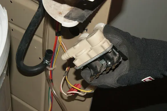 PHOTO: Remove the water inlet valve.