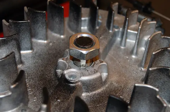 PHOTO: Thread the nut onto the end of the crankshaft.