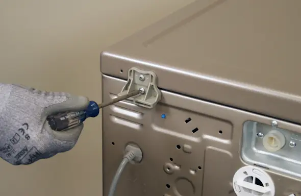 PHOTO: Remove the 2 screws from the back of the top panel.