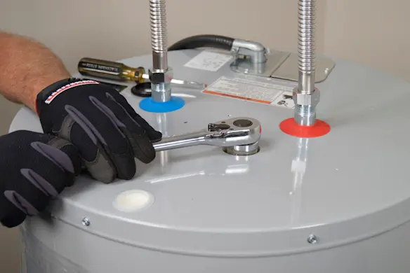 PHOTO: Unthread the anode rod.