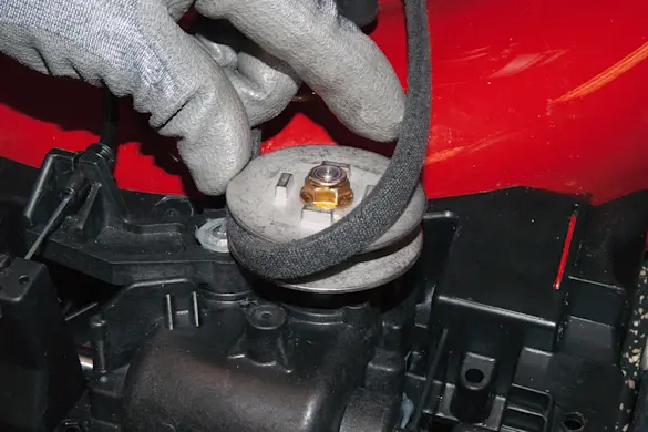 PHOTO: Release the drive belt from the transmission pulley.
