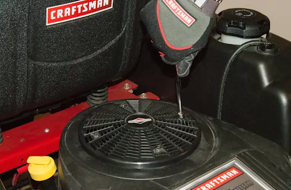 PHOTO: Remove the flywheel cover screws.