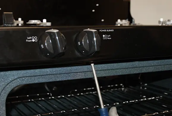 PHOTO: Remove the screws below the control manifold.