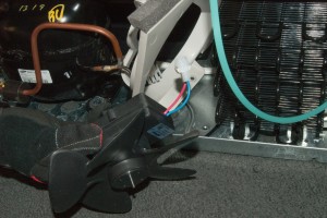 PHOTO: Remove the condenser fan from the bracket.