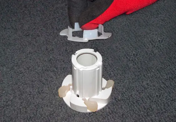 PHOTO: Remove the plastic bearing from the agitator cam.