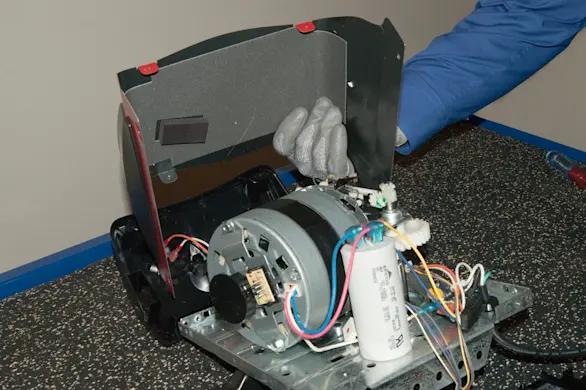 PHOTO: Remove the motor unit cover.