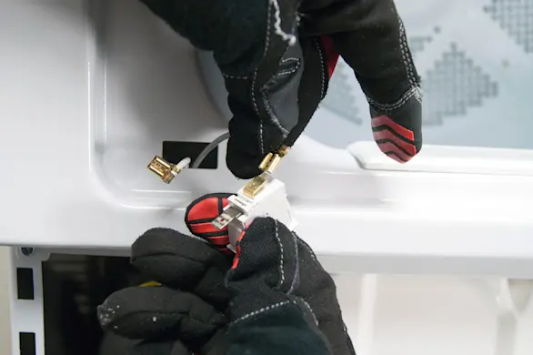 PHOTO: Connect the wires to the new door switch.