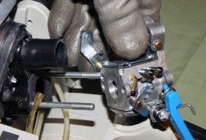 PHOTO: Pull the carburetor off the mounting studs.