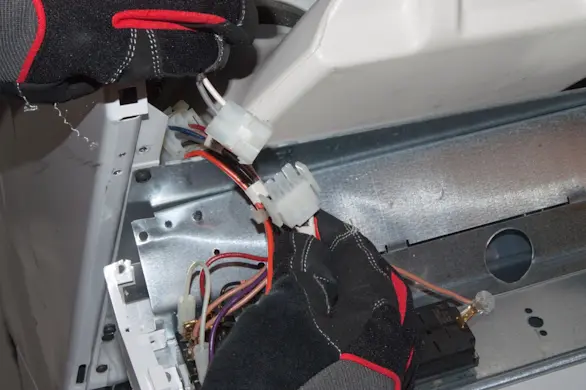 PHOTO: Unplug the dryer door switch harness.