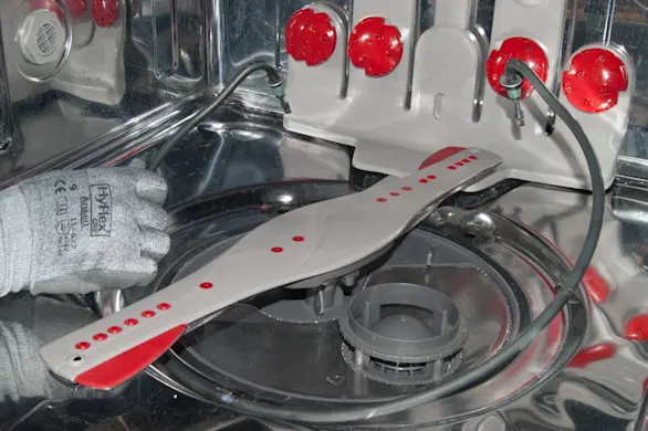 PHOTO: Install the new dishwasher heating element.