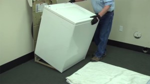 PHOTO: Slide the cabinet forward and remove it from the frame.