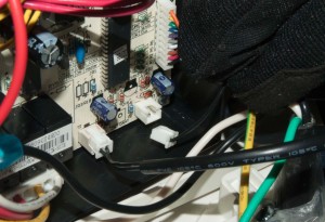 PHOTO: Disconnect the black ambient thermistor wire from T1 connector on the control board.