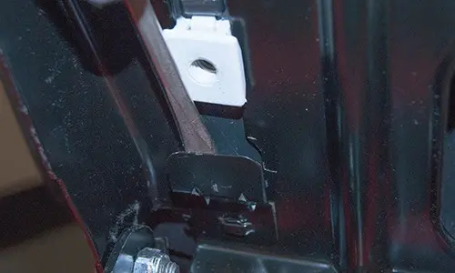 PHOTO: Release the seat locking tab.