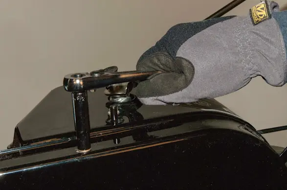 PHOTO: Remove the drive belt cover mounting screws.