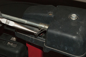 Remove the cotter pin from the chute control shaft.