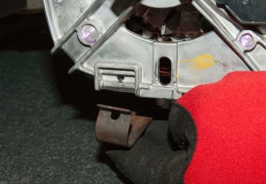 PHOTO: Reinstall the bottom motor retainer clip.
