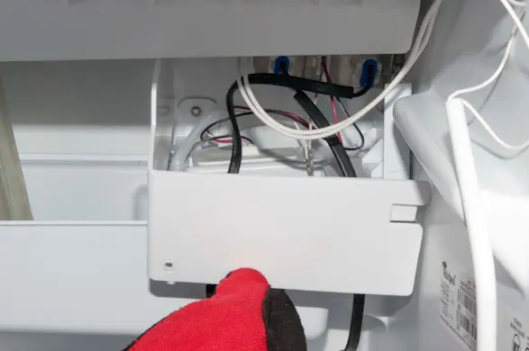 PHOTO: Remove the recirculation pump shield.