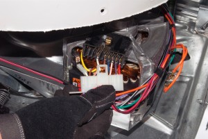 PHOTO: Disconnect the wire harness from the washer drive motor.