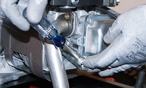 PHOTO: Remove the old spark plug.