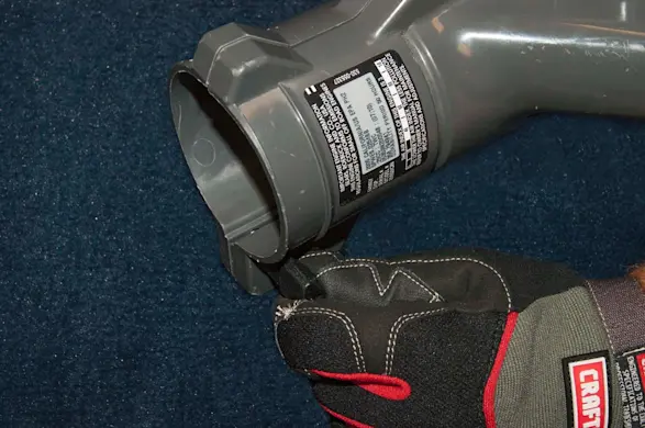 PHOTO: Remove the blower tube thumb screw.