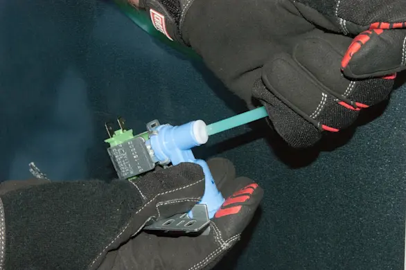 PHOTO: Push the water line into the valve.