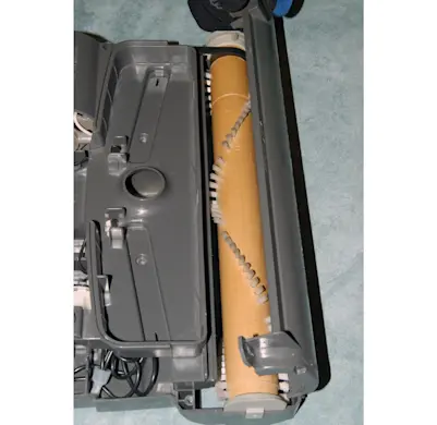 PHOTO: Remove the brush roller cover.