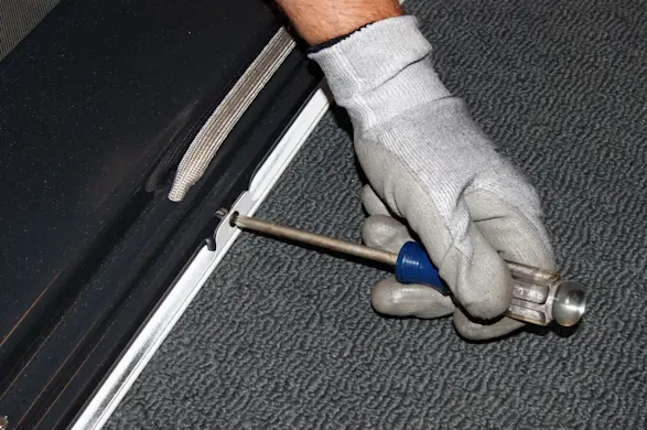 PHOTO: Remove the bottom screws.