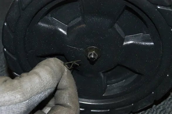 PHOTO: Reinstall the axle rod cotter pin.