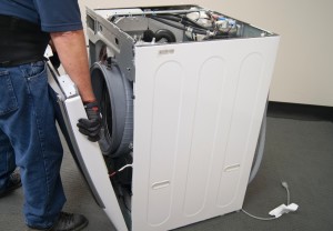 PHOTO: Remove the front panel from the washer.