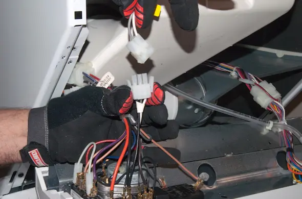 PHOTO: Reconnect the door switch wires.