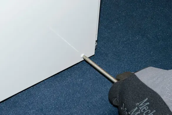 PHOTO: Remove the side screws.