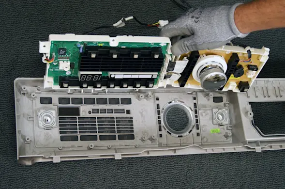 PHOTO: Remove the user interface board from the washer.