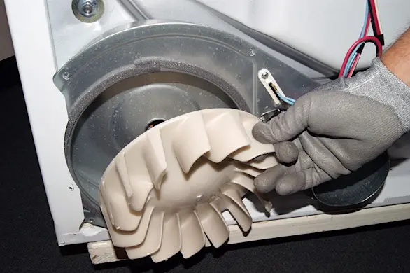 PHOTO: Remove the blower wheel.