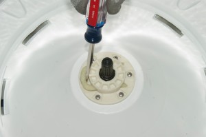 PHOTO: Insert a screwdriver on the retainer clip.