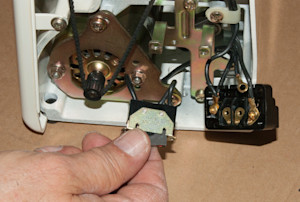 Remove the on/off switch from the sewing machine.